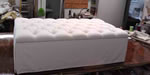 tufted storage ottoman with tailored skirt